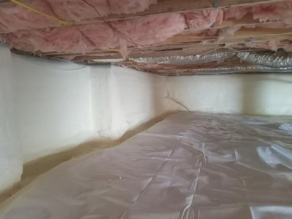 Crawl space encapsulation with closed-cell spray foam for Commercial Roof Restoration in Norwich